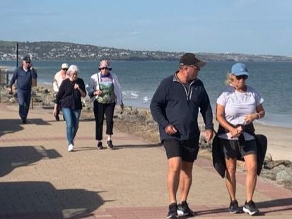 Walking Group on a stroll along the beach