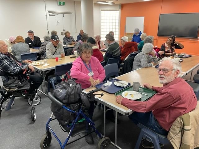 Part of Guests and Members dining at Citiplace after a rail trip to the International Airport. Prominent member Elsie Tester who attends meetings and events of three other Branches and Curtis Clark are in the foreground. They have been long-standing membe